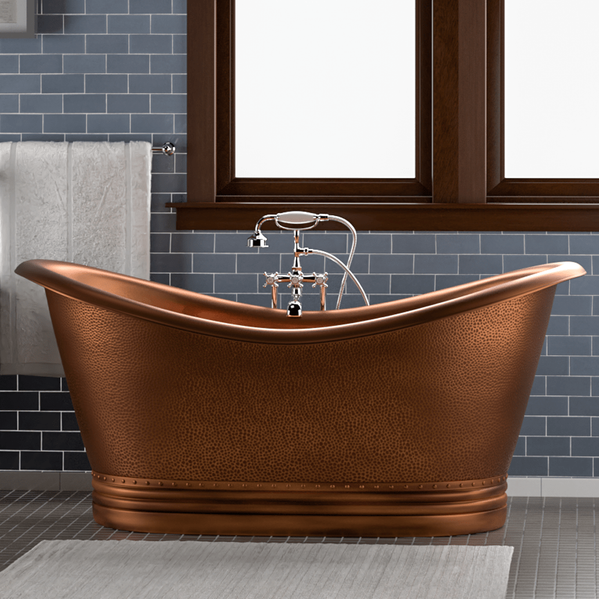 copper double ended bathtub on grey background