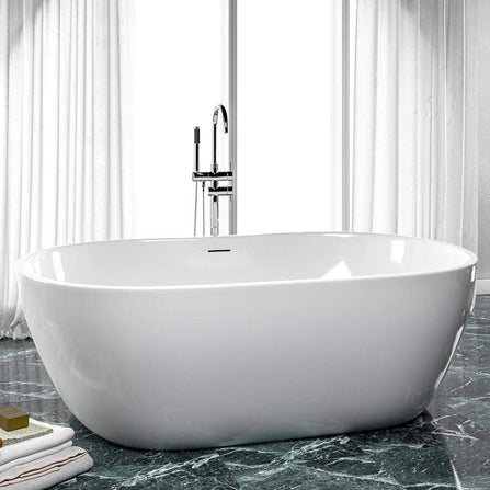 white bathtub with tiled background